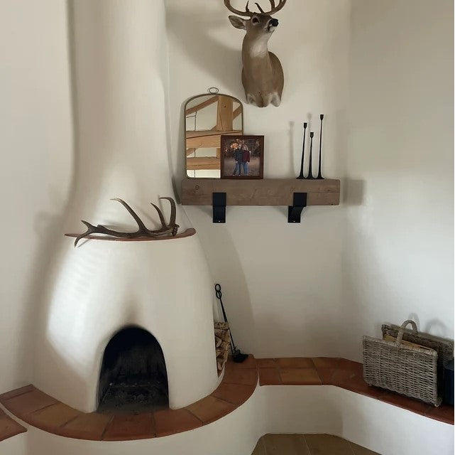 Abode style home with sleek black mantel brackets